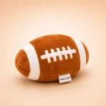 Peluche ballon de rugby pour chien