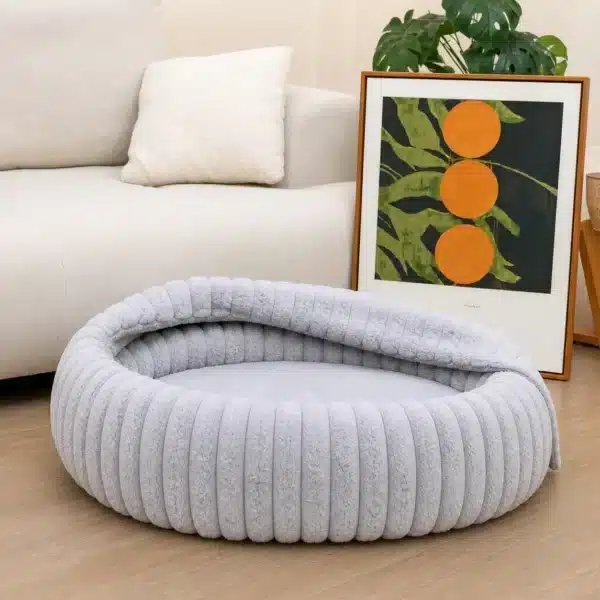 Lit pour chien avec une couverture